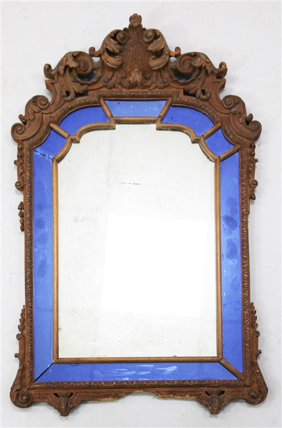 A 19th century Continental carved wood cartouche shaped wall mirror, W.1ft 9in. H.2ft 8in.